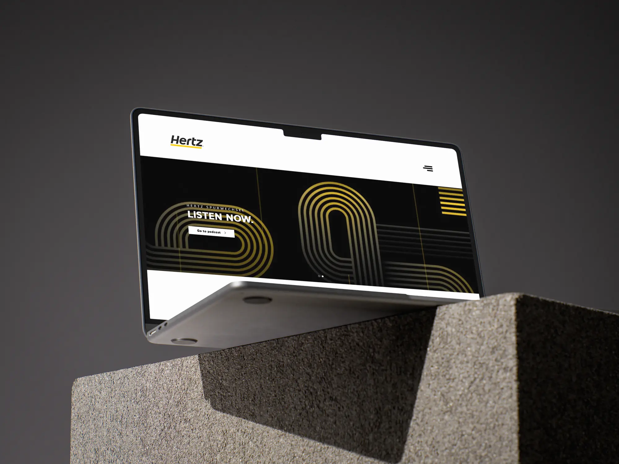 Hertz MiniLease interface on a laptop mockup