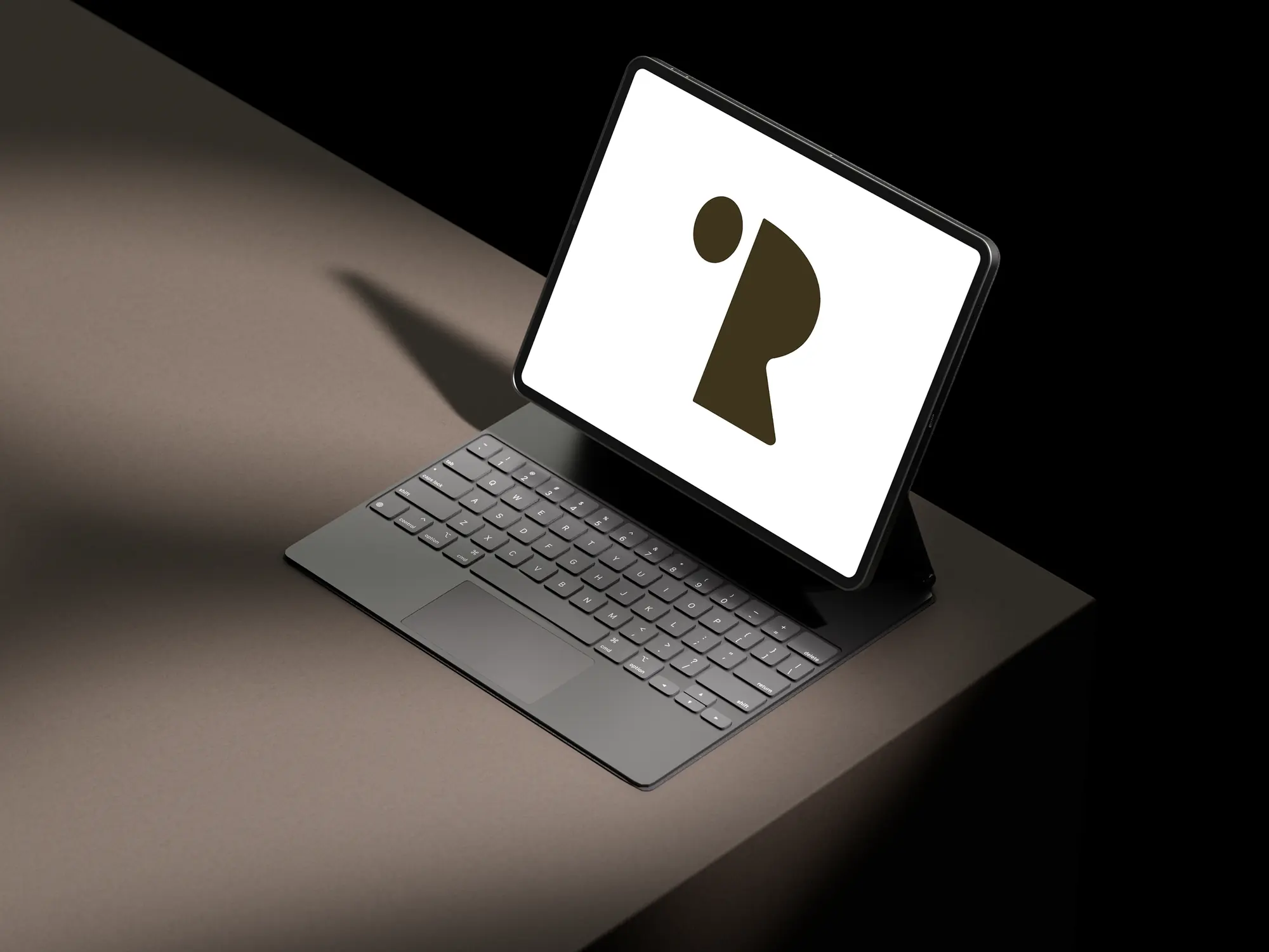 Imre Rajci logo mark shown on a tablet mockup